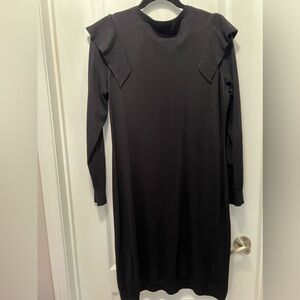 Black sweater dress with shoulder detail.